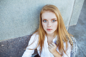 portrait of a beautiful girl with freckles, close-up