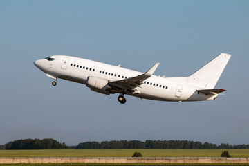 White passenger airplane takes off