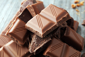 Dark Chocolate chunks and stacked broken chocolate bar.