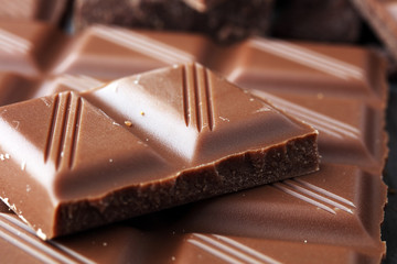 Dark Chocolate chunks and stacked broken chocolate bar.