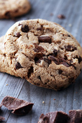 Chocolate cookies on wooden table. Chocolate chip cookies shot.