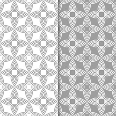 Gray and white geometric ornaments. Set of seamless patterns