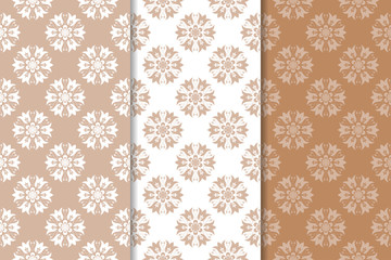 Brown floral backgrounds. Set of seamless patterns