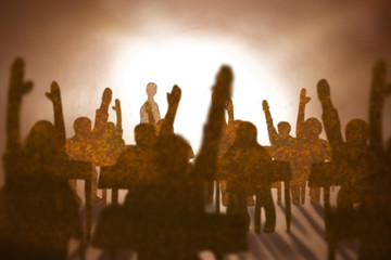 Students arms up inclassroom ,brown paper silhouette style. .