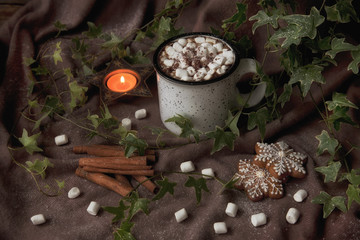 Fototapeta na wymiar Coffee mug with marshmallow and gingerbread. Christmas concept, background, close-up, selective focus