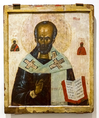 Antique Russian orthodox icon of St. Nicholas painted on wooden board