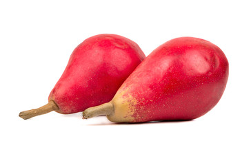 Two ripe red fruit pears on a white background closeup