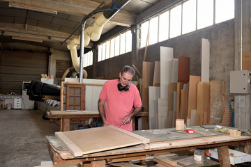 a carpenter working in his workshop