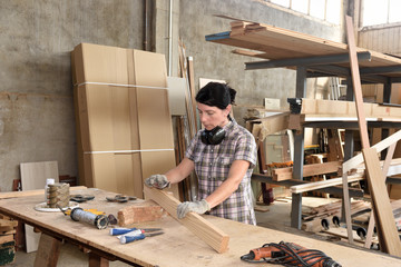 a woman working in a carpentry workshop