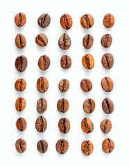 Fresh roasted coffee beans on white, in seven rows and five columns