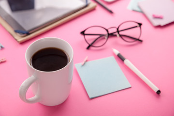 Workspace of a creative office employee. Working with a cup of coffee, using phone and tablet