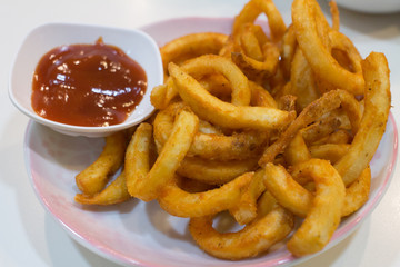 Homemade fast food portion of french fries with Tomato sauces