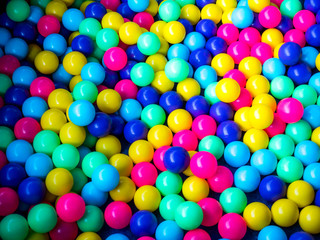 Many colour plastic balls, children's party, a games room, a box filled with small colored balls