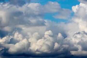 Naklejka na ściany i meble Classic painterly cloudscape. Fluffy white clouds against blue sky background.