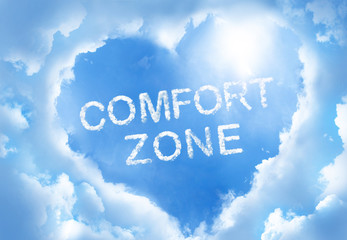 Fototapeta premium Comfort zone cloudword inside heart cloud frame on blue sky background.