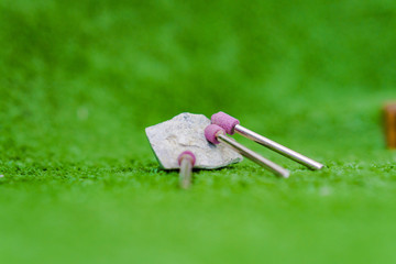 Cutters for engraving lying on a stone or grass. Grinding drills and a cutter for jewelers....