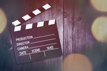 Movie clapper board on wooden background