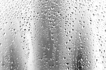 Naklejka na ściany i meble texture of a drop of rain on a glass wet transparent background