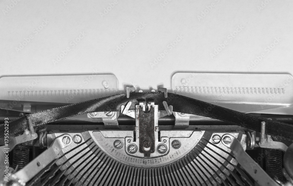 Fototapete mock up a blank sheet of paper in a vintage typewriter. mechanisms close-up. input on an old typewri