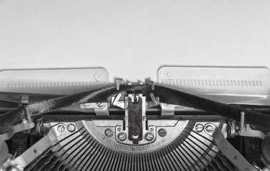 mock up a blank sheet of paper in a vintage typewriter. Mechanisms close-up. Input on an old...