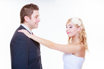 Happy groom and bride posing for marriage photo