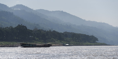 Houseboat travelling along the River Mekong, Laos