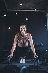 Fototapeta na wymiar Beautiful athletic woman - fitness workout in gym.