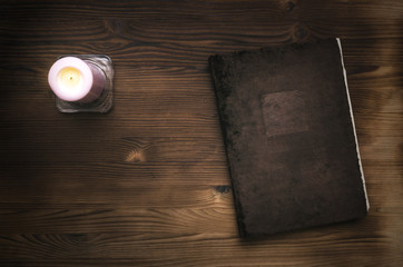 Book of magic on the wooden table with copy space. Witchcraft.