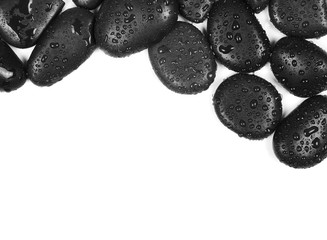 Obraz na płótnie Canvas Black spa stones with water drops isolated on white background, top view