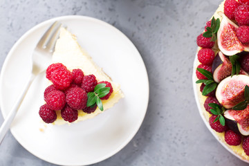 Cheesecake with raspberries and figs on a gray background, raspberry, berries, cake, horizontal, soft focus, sweets
