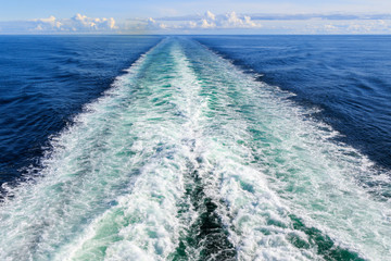 Trail on water surface behind the ferry