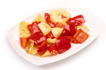 fried Bulgarian pepper on a white plate isolated on white background