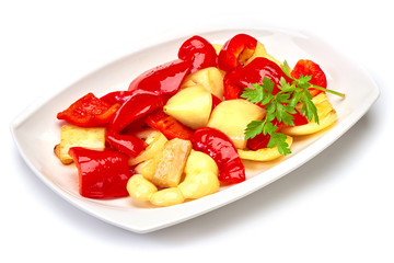 fried Bulgarian pepper on a white plate isolated on white background