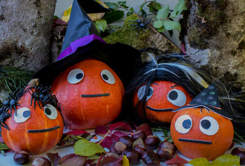 Pumpkin family congratulates on the holiday Halloween.