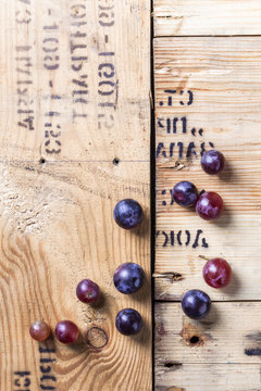 Red Grapes Overhead Group On Old Rustic Wooden Table In Studio