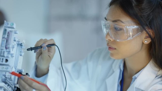  Portrait smiling engineer working in electronics factory