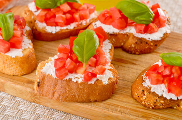bruschetta with tomato on table