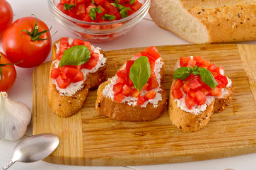 bruschetta with tomato on table