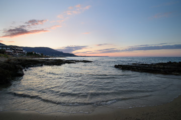 Obraz premium Sunset over the sea. Stalida, Crete, Greece. Autumn, the end of the tourist season.