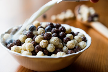 Chocolate Corn balls with milk pouring
