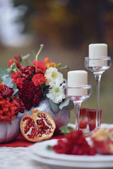 autumnal floristic decor on the street wedding table setting