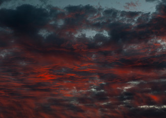 View of candy red clouds at sunset