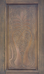 Vintage decorative wooden ornament on a door
