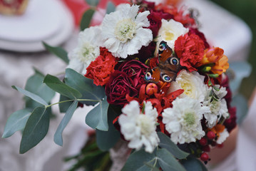autumnal floristic decor on the street. autumn bouquet of the bride