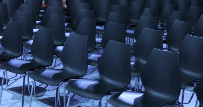 View of empty Conference hall with comfortable seats. conference room for the business audience. Free empty chairs or armchairs. In anticipation of the beginning of the seminar or lecture