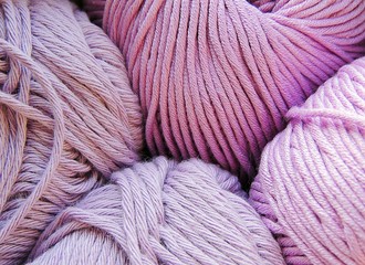 Lilac cotton yarn balls for knitting.