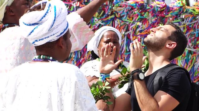 Candomble group blessing a tourist in Salvador, Bahia, Brazil