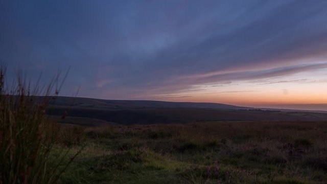 timelapse during sunset of the rolling wild hills of Exmoor, devon, uk