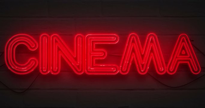 3D rendering flickering blinking red neon sign on dark brick background, cinema movie film entertainment sign concept
