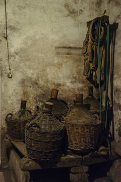 Old cellar with demijohns